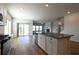 Open kitchen with large island, modern appliances, and seamless connection to the living space at 1057 Towne Mill Xing, Canton, GA 30114
