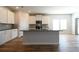 Modern kitchen featuring an island, sleek countertops, and stainless-steel appliances at 1057 Towne Mill Xing, Canton, GA 30114