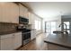 Modern kitchen featuring an island, stainless steel appliances, and a sliding glass door at 1057 Towne Mill Xing, Canton, GA 30114