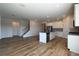Open concept floorplan featuring modern kitchen, dining area, and staircase at 1057 Towne Mill Xing, Canton, GA 30114