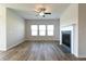Comfortable living room with wood floors, fireplace, and lots of natural light at 1057 Towne Mill Xing, Canton, GA 30114