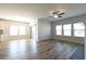 Open concept living room with wood floors, fireplace, and lots of natural light at 1057 Towne Mill Xing, Canton, GA 30114