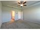 Inviting main bedroom features a tray ceiling, ceiling fan, and ensuite bathroom at 1057 Towne Mill Xing, Canton, GA 30114