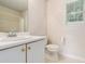 Bathroom featuring a neutral color palette, single sink vanity, and toilet at 2601 Brandenberry Dr, Decatur, GA 30034