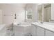Bright bathroom featuring a garden tub, single sink vanity, and fish decor at 2601 Brandenberry Dr, Decatur, GA 30034