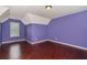 This bedroom has hardwood floors, a light, and a window at 2601 Brandenberry Dr, Decatur, GA 30034
