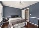 Comfortable bedroom with hardwood floors, neutral bedding, and soft natural light at 2601 Brandenberry Dr, Decatur, GA 30034