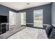 Bedroom boasts a calming color palette, natural light, and a comfortable, stylish design at 2601 Brandenberry Dr, Decatur, GA 30034