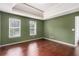 Bedroom featuring hardwood floors, tray ceiling, with an abundance of natural light at 2601 Brandenberry Dr, Decatur, GA 30034