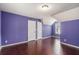 This bedroom has hardwood floors, a light, and two doors at 2601 Brandenberry Dr, Decatur, GA 30034