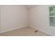 This bedroom has carpet and a window at 2601 Brandenberry Dr, Decatur, GA 30034