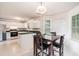 Sunlit dining area with a view of the kitchen, perfect for Gathering meals and entertaining guests at 2601 Brandenberry Dr, Decatur, GA 30034