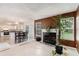 Inviting living room featuring a fireplace and seamless flow into the adjacent dining area and kitchen at 2601 Brandenberry Dr, Decatur, GA 30034