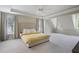 Spacious main bedroom with tray ceiling, neutral carpet, and natural light from large windows at 1021 Bluffhaven Ne Way, Atlanta, GA 30319