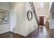 Bright foyer featuring hardwood floors, white walls, a staircase, and chandelier lighting at 1021 Bluffhaven Ne Way, Atlanta, GA 30319