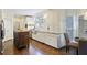 Bright kitchen with white cabinets, granite countertops, stainless steel appliances, and hardwood floors at 1021 Bluffhaven Ne Way, Atlanta, GA 30319