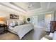 Spacious main bedroom featuring a tray ceiling, neutral color palette, and plenty of natural light at 1021 Bluffhaven Ne Way, Atlanta, GA 30319