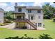 Multi-tiered back porch and patio overlooking the spacious backyard and lawn at 2500 Ashbourne Dr, Lawrenceville, GA 30043