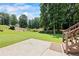 Large backyard with stairs leading to a wooded area at 2500 Ashbourne Dr, Lawrenceville, GA 30043