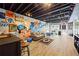 Finished basement featuring exposed ceiling, fun wall art, recessed lighting, and laminate flooring at 2500 Ashbourne Dr, Lawrenceville, GA 30043