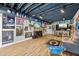 Spacious basement featuring laminate flooring, sports-themed decor, a bar area, and entertainment space at 2500 Ashbourne Dr, Lawrenceville, GA 30043