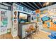 Basement sports bar with wall decor, TV, bar area, and laminate flooring, ready for entertaining! at 2500 Ashbourne Dr, Lawrenceville, GA 30043