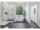 Bright bathroom with soaking tub, walk-in shower, modern tile and large arched window at 2500 Ashbourne Dr, Lawrenceville, GA 30043