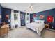 Bedroom with plush carpet, white curtains, and blue walls at 2500 Ashbourne Dr, Lawrenceville, GA 30043