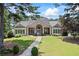 Charming clubhouse with stone accents, manicured lawn, and welcoming entrance at 2500 Ashbourne Dr, Lawrenceville, GA 30043