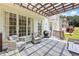 Spacious deck with wicker chairs and patio furniture, plus string lights for outdoor relaxation and entertainment at 2500 Ashbourne Dr, Lawrenceville, GA 30043