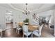 Cozy dining room with chandelier and view into the open floor plan at 2500 Ashbourne Dr, Lawrenceville, GA 30043