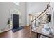 Bright foyer featuring hardwood floors, staircase, and soaring ceilings at 2500 Ashbourne Dr, Lawrenceville, GA 30043
