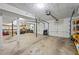 Spacious three-car garage with concrete floor, built-in shelving, and ample storage space at 2500 Ashbourne Dr, Lawrenceville, GA 30043