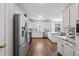 Bright kitchen with white cabinets, stainless steel appliances and marble countertops at 2500 Ashbourne Dr, Lawrenceville, GA 30043