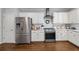 Modern kitchen featuring stainless steel appliances and white cabinetry at 2500 Ashbourne Dr, Lawrenceville, GA 30043
