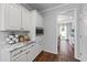 Kitchen area with white cabinets and marble countertops at 2500 Ashbourne Dr, Lawrenceville, GA 30043