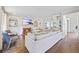 Bright living room with fireplace, TV, hardwood floors, neutral paint and sofa and built-in bookshelves at 2500 Ashbourne Dr, Lawrenceville, GA 30043