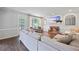 Bright living room with hardwood floors, fireplace, TV, and french doors leading to an outdoor space at 2500 Ashbourne Dr, Lawrenceville, GA 30043