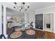Open concept living room and kitchen with fireplace and large black chalkboard with weekly chores at 2500 Ashbourne Dr, Lawrenceville, GA 30043