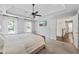 Bright main bedroom with tray ceilings, plush carpet and large windows at 2500 Ashbourne Dr, Lawrenceville, GA 30043