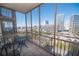 Balcony with city views, table and chairs, perfect for relaxing outdoors at 300 Peachtree Ne St # 11C, Atlanta, GA 30308