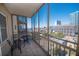 Balcony with city views, table and chairs, perfect for relaxing outdoors at 300 Peachtree Ne St # 11C, Atlanta, GA 30308