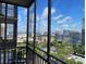 Balcony with city views and seating, ideal for enjoying the cityscape at 300 Peachtree Ne St # 11C, Atlanta, GA 30308