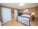 Cozy bedroom with parquet floors, neutral walls, and a comfortable iron-frame bed at 300 Peachtree Ne St # 11C, Atlanta, GA 30308
