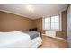 Simple bedroom with a comfortable bed, desk, and ample natural light at 300 Peachtree Ne St # 11C, Atlanta, GA 30308