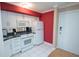 Efficient kitchen equipped with white cabinetry and appliances at 300 Peachtree Ne St # 11C, Atlanta, GA 30308
