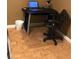 Practical office space with desk, rolling chair, and parquet floors at 300 Peachtree Ne St # 11C, Atlanta, GA 30308