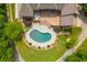 Beautiful aerial view of the kidney-shaped pool and deck area of this home's expansive backyard at 3505 Watson Rd, Cumming, GA 30028