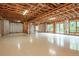 Unfinished basement featuring exposed ceiling and walls, and double doors leading outside at 3505 Watson Rd, Cumming, GA 30028