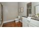 A bathroom with tile flooring features a shower and bathtub, a toilet, and a single sink at 3505 Watson Rd, Cumming, GA 30028